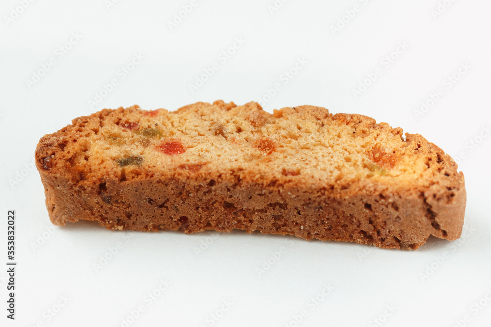 Popular Italian Biscotti or Cantucci biscuit cookie stuffed with candied fruit  isolated on white background with copy space.Side view closeup