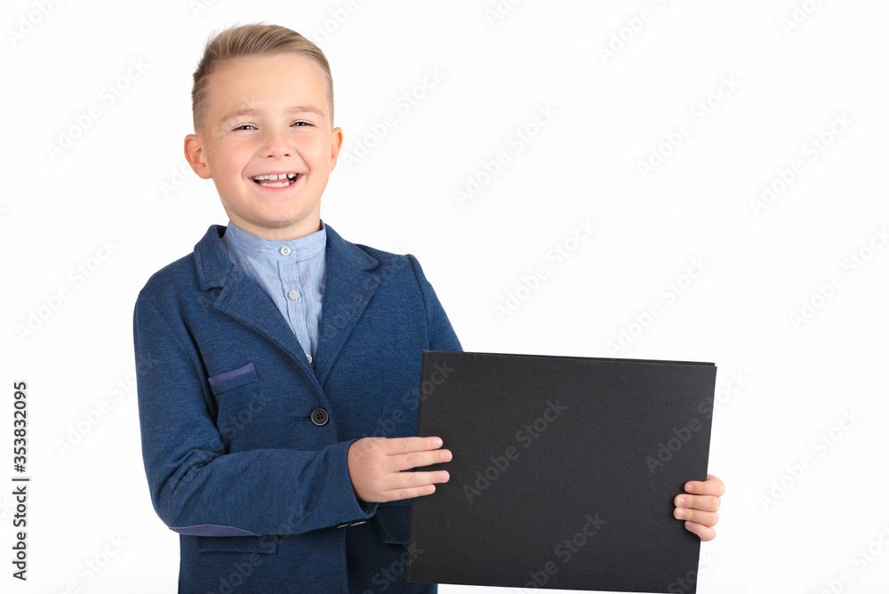 Happy exited caucasian young boy showing and displaying blank black board ready for your text or product.White background isolated. Happy exited caucasian young boy showing and displaying blank black board ready for your text or product.White background isolated.