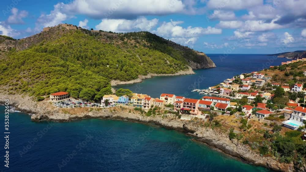 Aerial drone view video of beautiful and picturesque colorful traditional fishing village of Assos in island of Cefalonia, Ionian, Greece. Peninsula of Assos in Cephalonia (Kefalonia), Greece Aerial drone view video of beautiful and picturesque colorful traditional fishing village of Assos in island of Cefalonia, Ionian, Greece. Peninsula of Assos in Cephalonia (Kefalonia), Greece