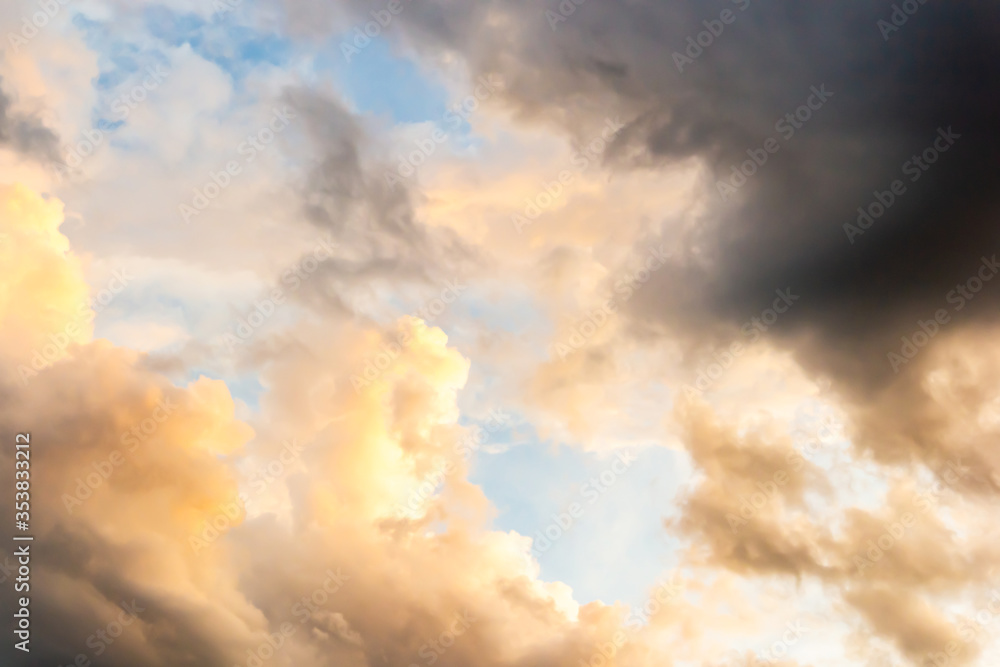 Colorful sunset sky above dark clouds with dramatic light before raining in twilight time . Beautiful sunset background