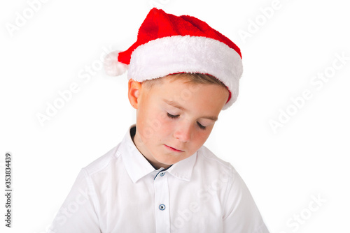 A young caucasian boy showing hand gesture. Kid portrait gesturing with fingers against. Funny emotions, facial expression, body language.