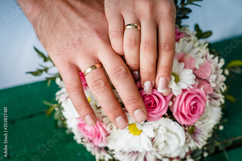 newlyweds, close-up hands with rings, joined together, hold hands © Рома Коваленко