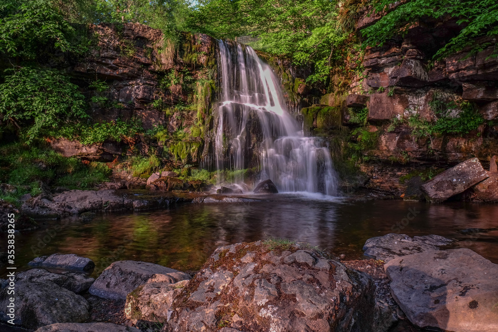 Obraz premium East Gill Force, Keld, Swaledale, in the dramtic countryside of North Yorkshire, fantastic adventure travel destination or holiday vacation to view picturesque scenery at sunrise or sunset