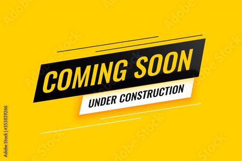 coming soon under construction yellow background design photo