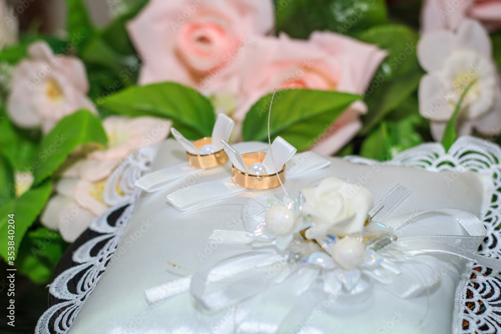 wedding rings on a pillow, put rings on each other, on a table wedding rings on a pillow, put rings on each other, on a table