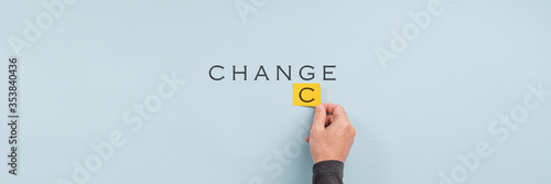 Male hand changing the word Change into Chance