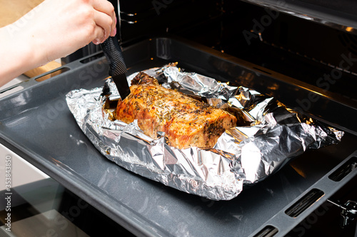 A large piece of baked meat. Roasted meat in the oven