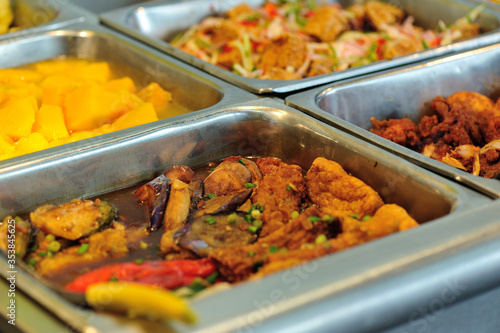 Steel tray filled with food inside the self service Chinese restaurant © lzf