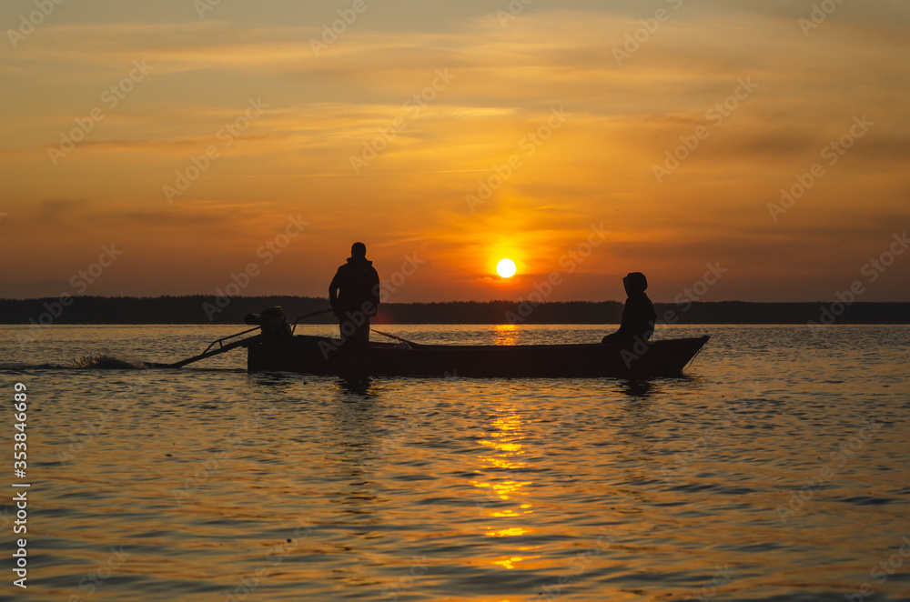 The fishermen and boat silhouette The fishermen and boat silhouette