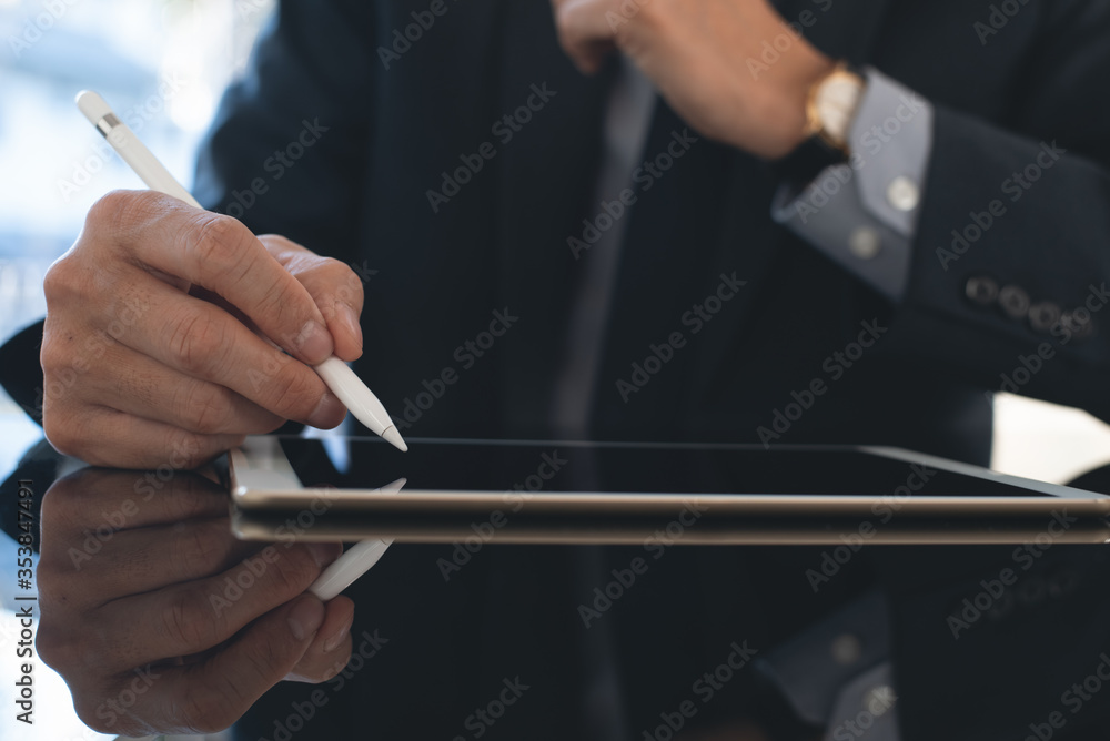 Businessman manager e signing business contract on digital tablet computer Businessman manager e signing business contract on digital tablet computer