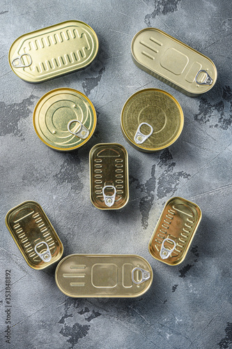 Face concept assortment types of shapes canned food, fish , fruits, vegetables, meat, soup top view on grey textured stone slate  background top view space for text.
