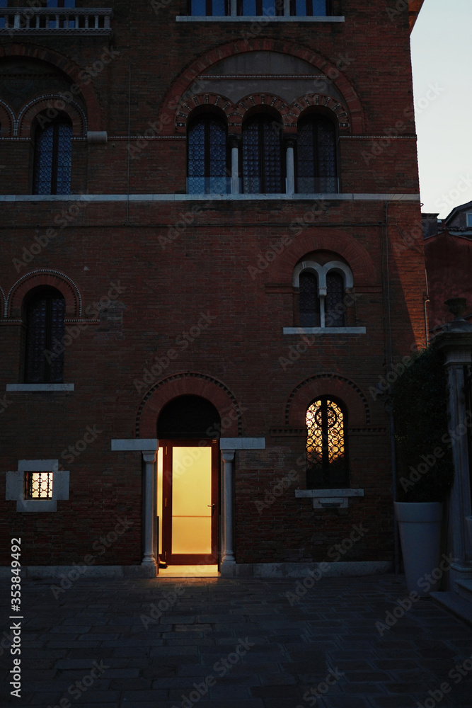 Fototapeta premium Old brick building architecture in the alley of Venice