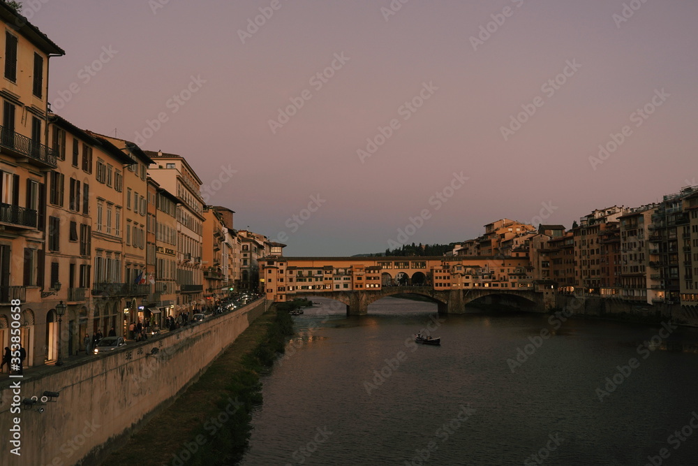 Famous Ponte Vecchio bridge at Florence Italy during sunset