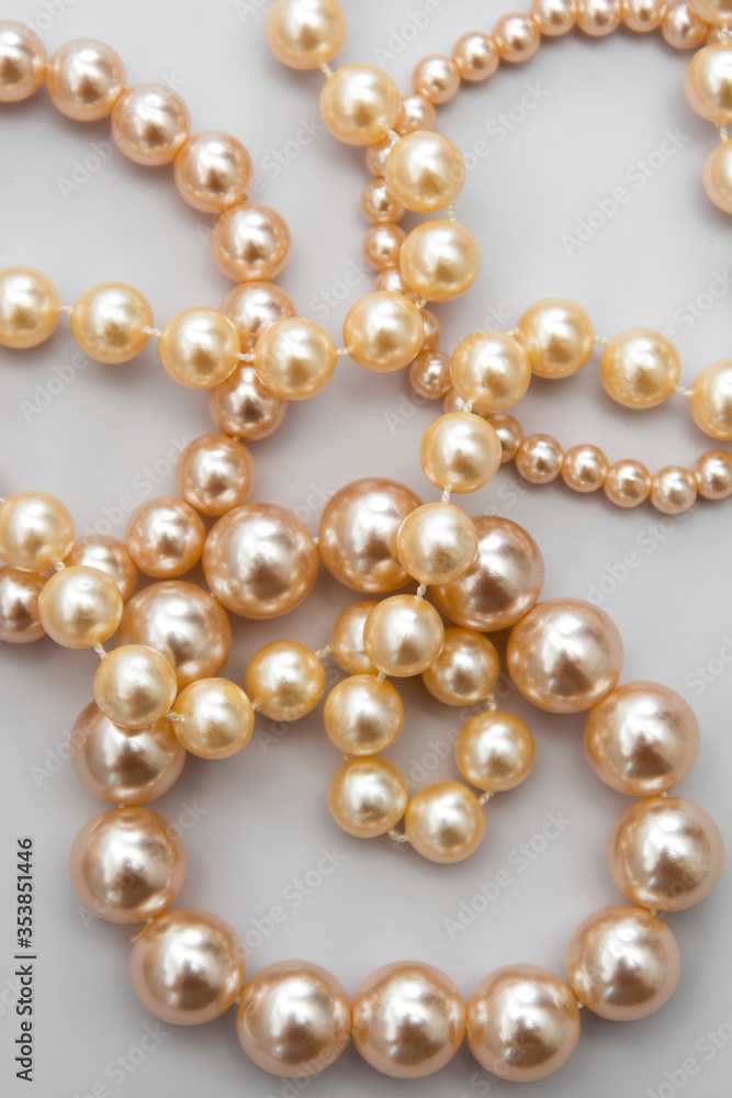 Abstract fashion background with white pearls on the gray background, isolated. Abstract fashion background with white pearls on the gray background, isolated.
