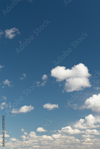Fototapeta Naklejka Na Ścianę i Meble -  white cumulus clouds on a blue sky. Place for text