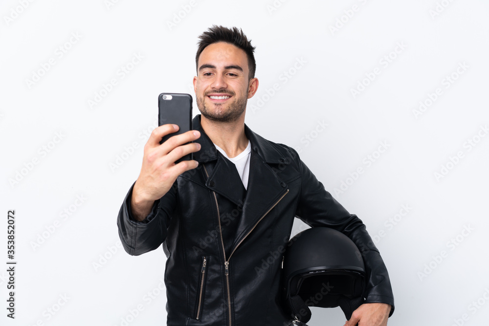 Man with a motorcycle helmet making a selfie Man with a motorcycle helmet making a selfie
