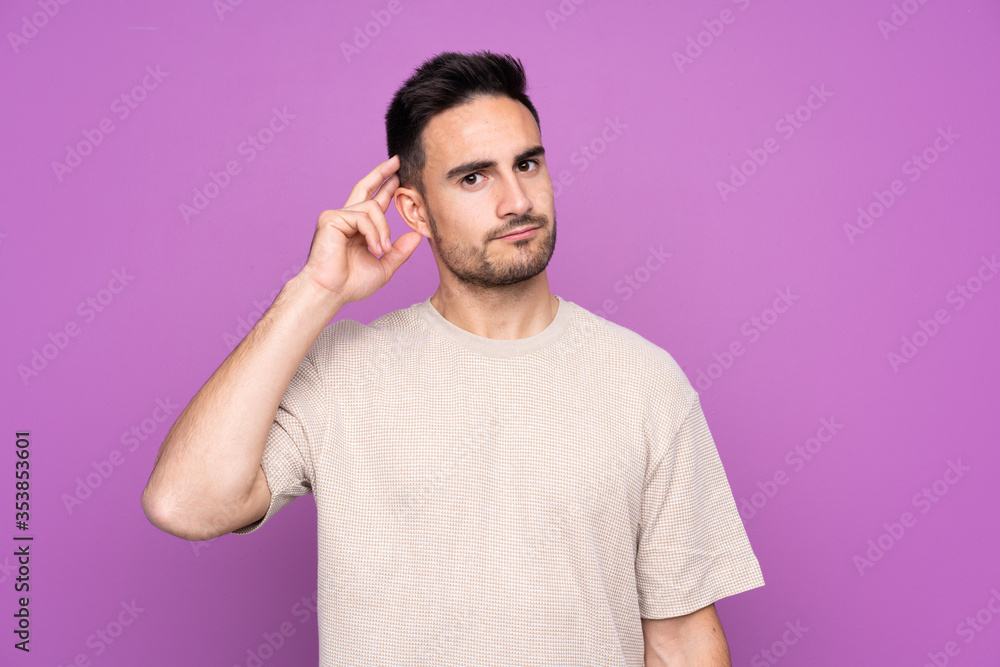 Young handsome man over isolated purple background having doubts Young handsome man over isolated purple background having doubts