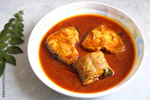 Indian Food -  Homemade Spicy and tangy rohu or rui fish curry. Bangali famous red fish curry made with Labeo rohita. Copy space. 