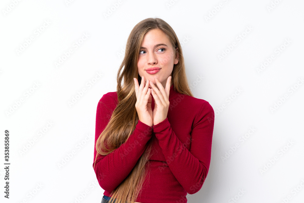 Teenager blonde girl over isolated white background scheming something Teenager blonde girl over isolated white background scheming something
