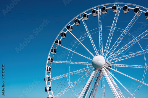 ferris wheel on blue sky background