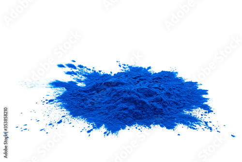 Blue spirulina powder isolated on white background. Phycocyanin extract. Natural superfood, vegan, healthy dietary supplement. Close-up of blue spirulina bacterium over white background. photo