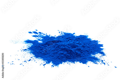 Blue spirulina powder isolated on white background. Phycocyanin extract. Natural superfood, vegan, healthy dietary supplement. Close-up of blue spirulina bacterium over white background.