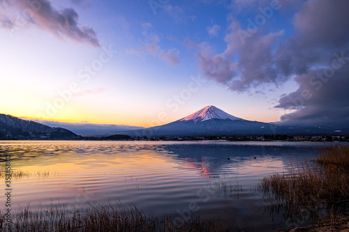 Red Mount Fuji with reflection on Lake Kawaguchiko during twilight