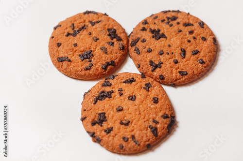 Three Americano cookies with chocolate chips isolated on white background