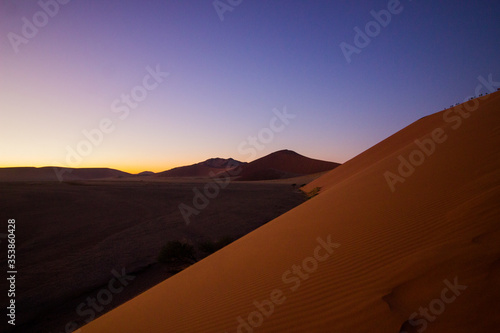 Huge sand dune in desert at sunrise