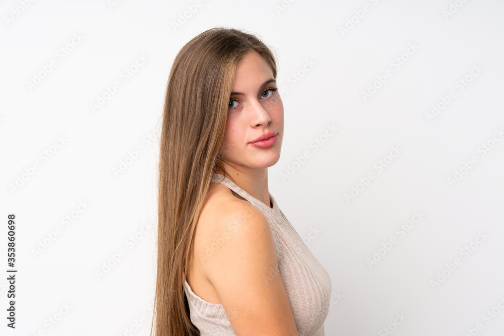 Portrait of beautiful teenager blonde girl over isolated white background Portrait of beautiful teenager blonde girl over isolated white background