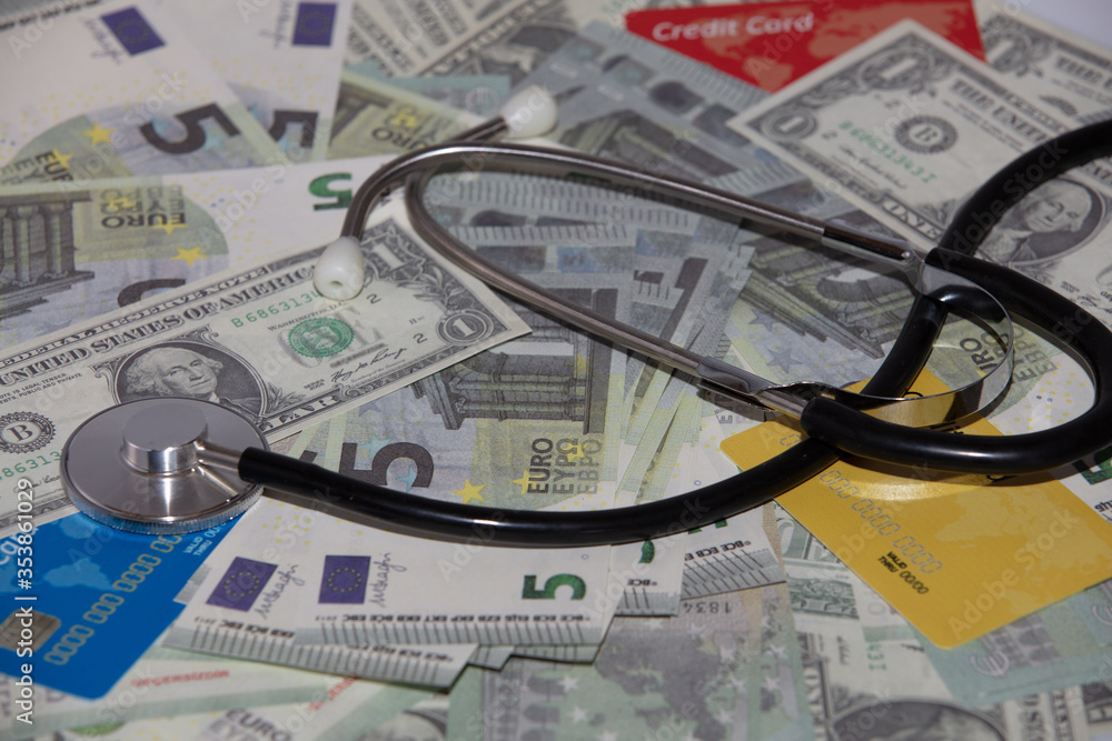 view of stethoscope on banknotes, health insurance concept view of stethoscope on banknotes, health insurance concept