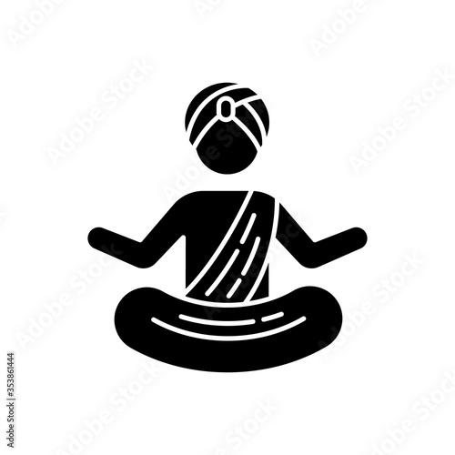 Yogi in turban black glyph icon. Practitioner of yoga. Physical and mental practices. Meditating Indian monk. Man in lotus position. Silhouette symbol on white space. Vector isolated illustration
