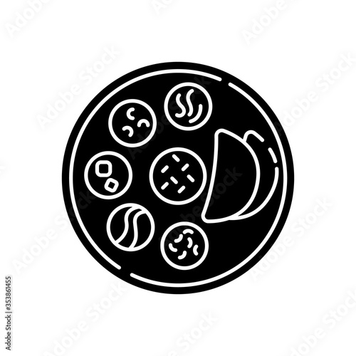 Indian thali black glyph icon. Traditional cuisine. Asian culture. Food habits of India. Chapati bread with sauces. Flatbreads on plate. Silhouette symbol on white space. Vector isolated illustration