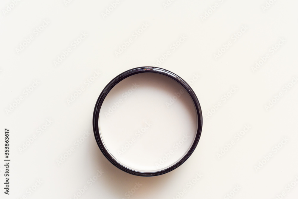 Men's hair product paste with black comb isolated on white background Men's hair product paste with black comb isolated on white background
