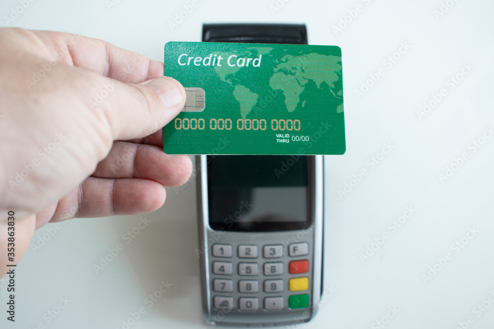 Credit Card And Pos Terminal On White Credit Card And Pos Terminal On White