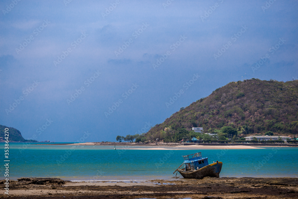 Blurred background of natural atmosphere by the sea, with clear skies and fishing boats mooring