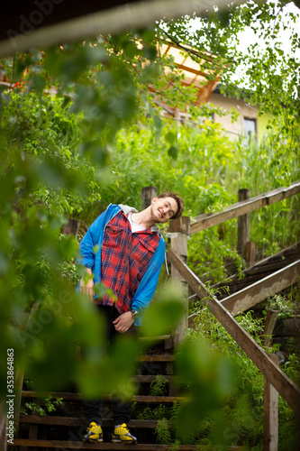 young guy relaxing in the garden