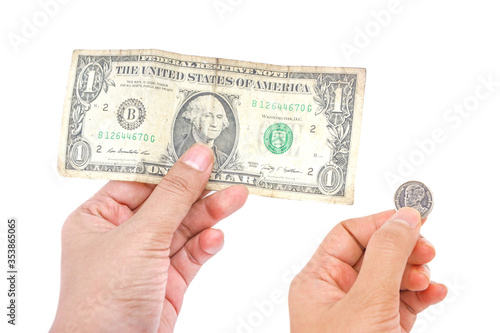 One dollar in hand and Thai Baht Coins (one baht ) in hand  Isolated on white background, Old one dollar banknote, saving money concept, banking or donation