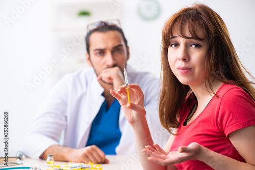 Female diabetic patient visiting young male doctor