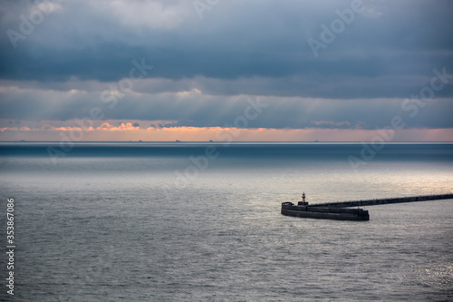 Wallpaper Mural sunset on the sea breakwater Torontodigital.ca