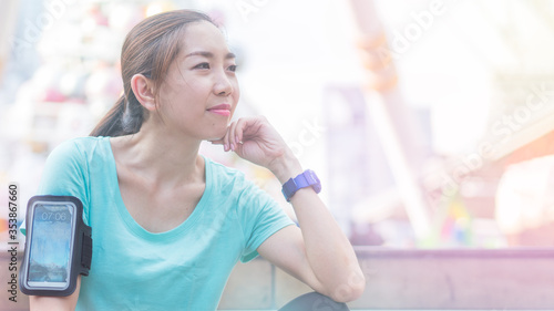 Sport woman resting after morning run. Health and Exercise concept