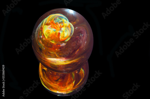Tableau sur toile multicolored glass paperweight against black