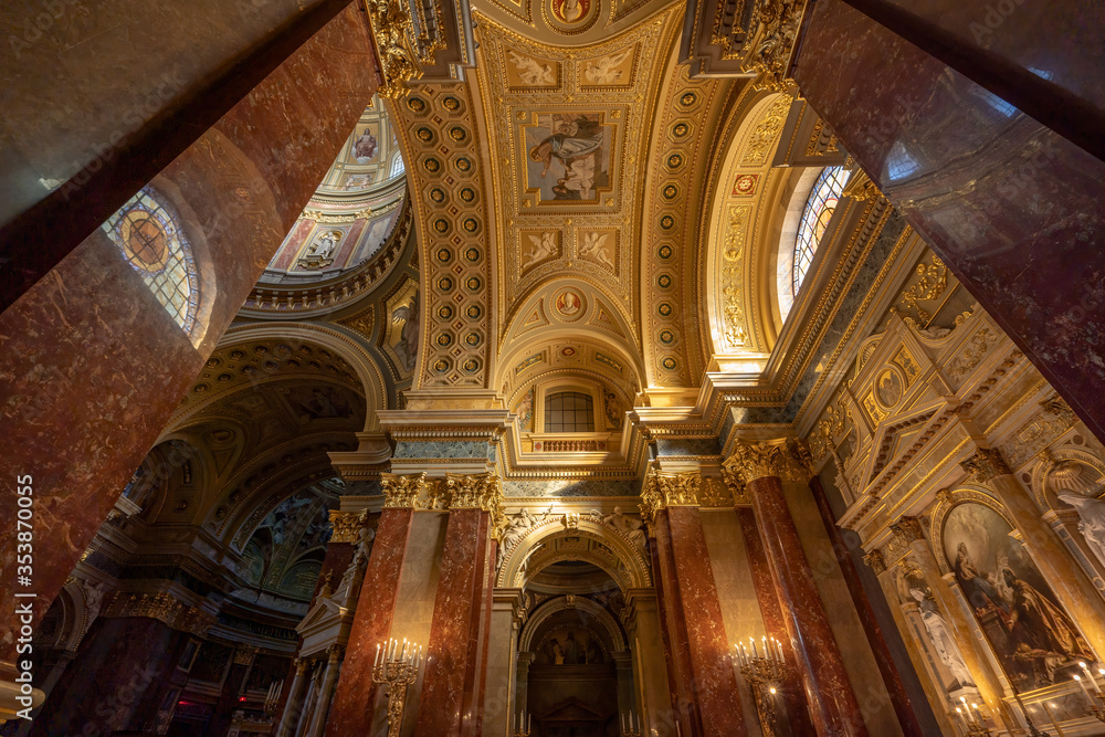 Budapest, Hungary - Feb 8, 2020: Ultrawide view of ceiling window inside St. Stephen Basilica with sunshine