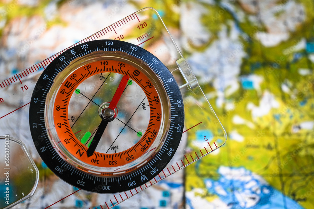 Naklejka premium Orientation by map and compass.