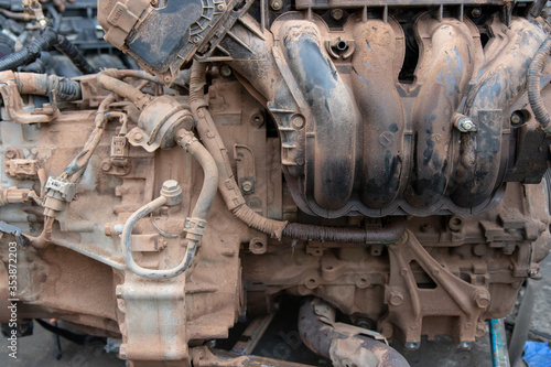 Parts of car's engine, car's engine in fixed process, rusty metal.