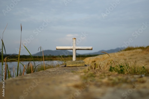 cross in the field made by pipes