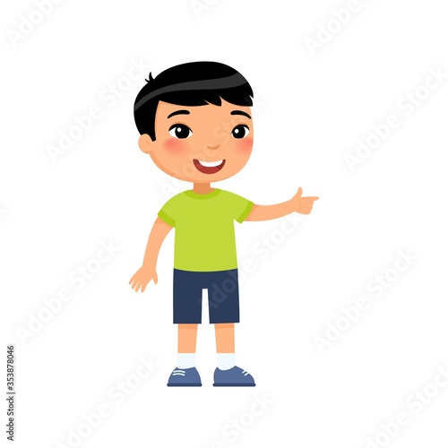 Little asian boy pointing with index finger flat vector illustration. Smiling male child  standing cartoon character. Kid showing direction, paying attention gesture isolated on white background