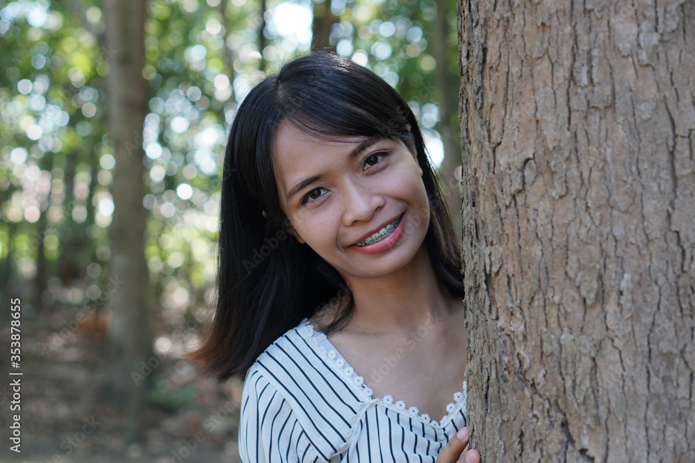 Asian women embrace trees with love, the concept of love for the world Asian women embrace trees with love, the concept of love for the world
