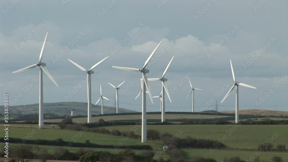 Wind turbines on farm fields in England countryside UK Wind turbines on farm fields in England countryside UK