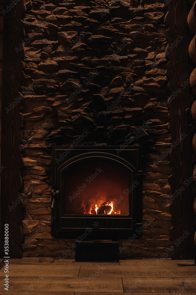 Fireplace with lit wood.Fire.Stone wall Fireplace with lit wood.Fire.Stone wall